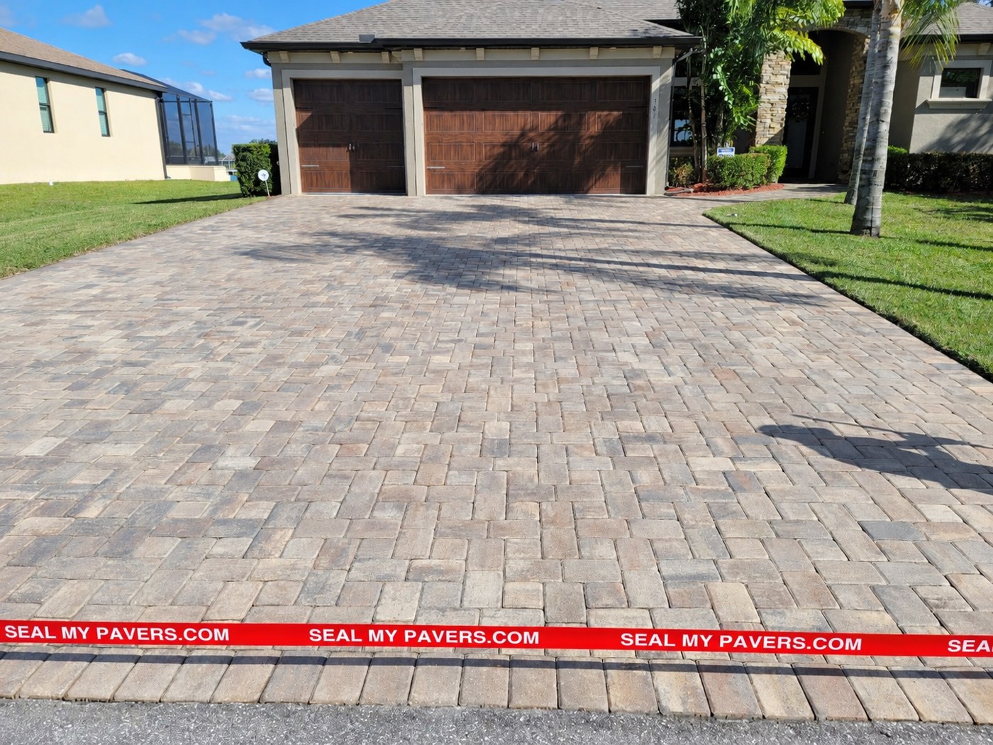 Dry, matte driveway pavers at Port Charlotte, Florida, shown in the unfinished comparison.